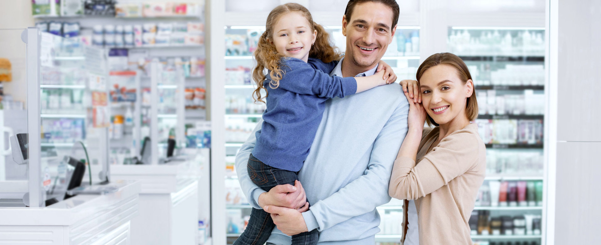 pharmacist with a woman and child